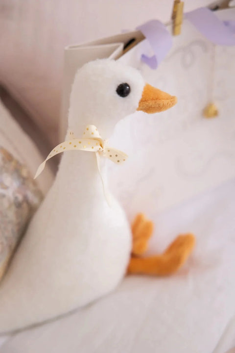 A close-up of the plush Henry the Goose toy.