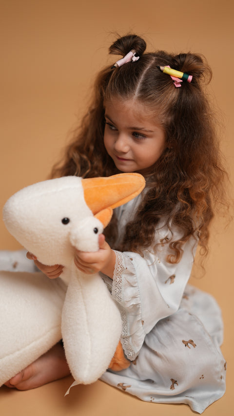 Kid with Plush toy Goose Henry in Henry The Goose pajama.